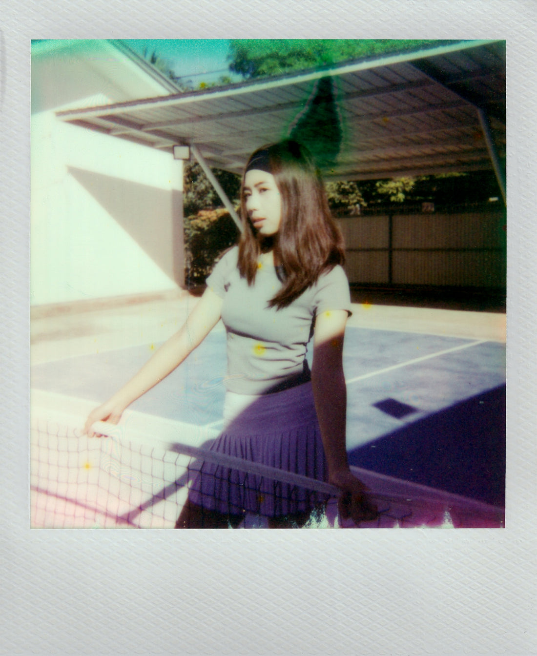 Woman in sportswear on tennis court