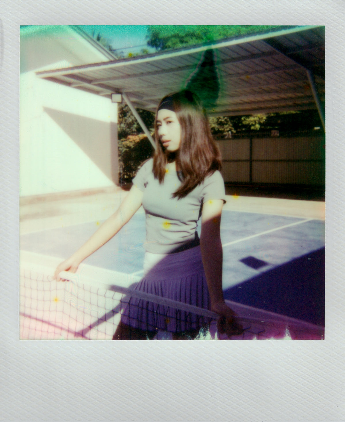 Woman in sportswear on tennis court